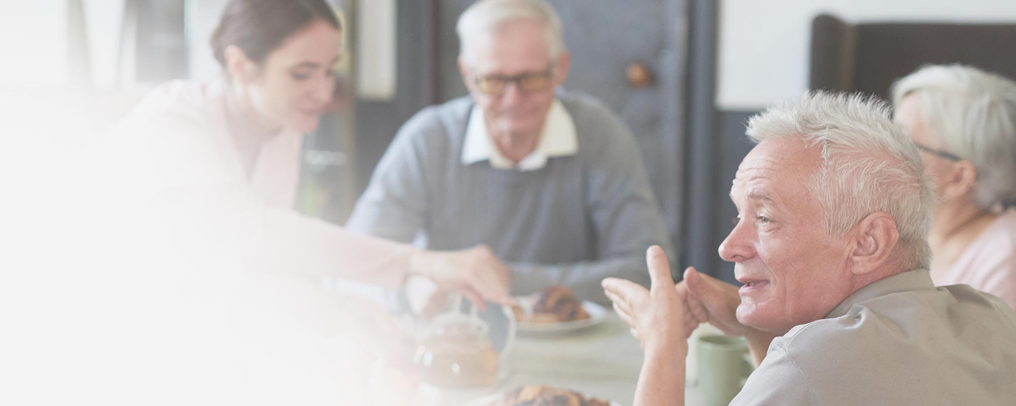 Residents enjoying a meal together
