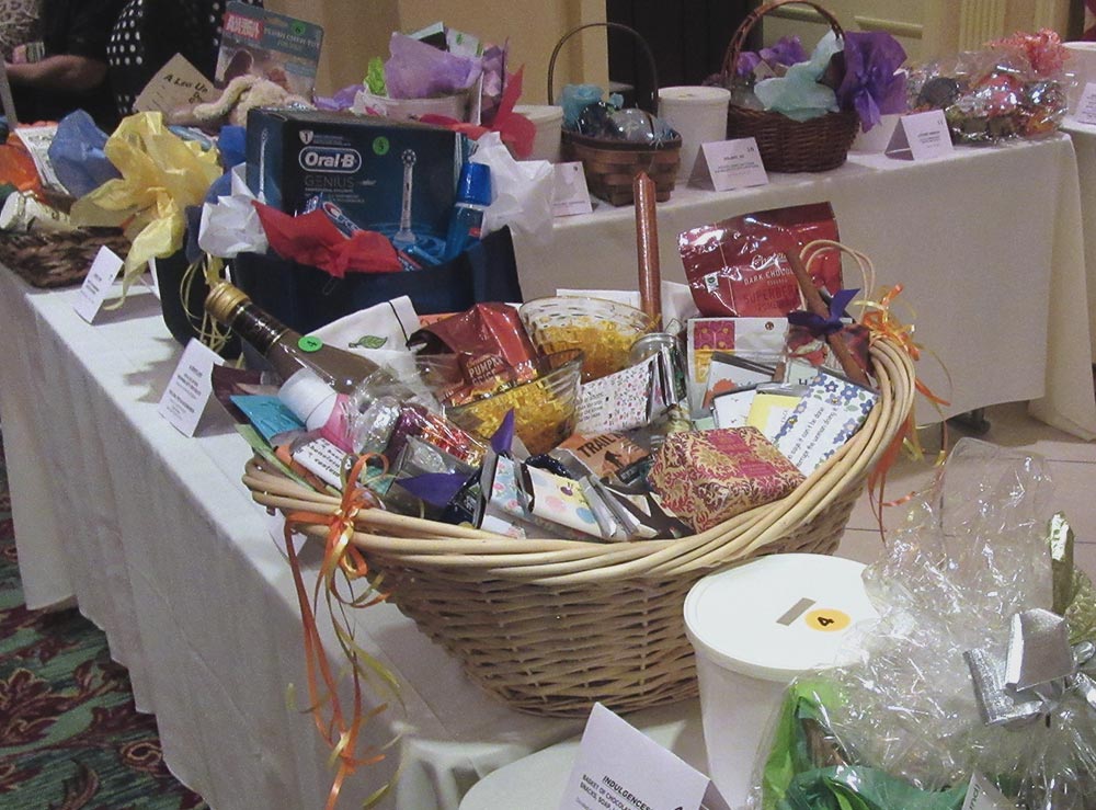 Basket featuring a variety of gift items for an event