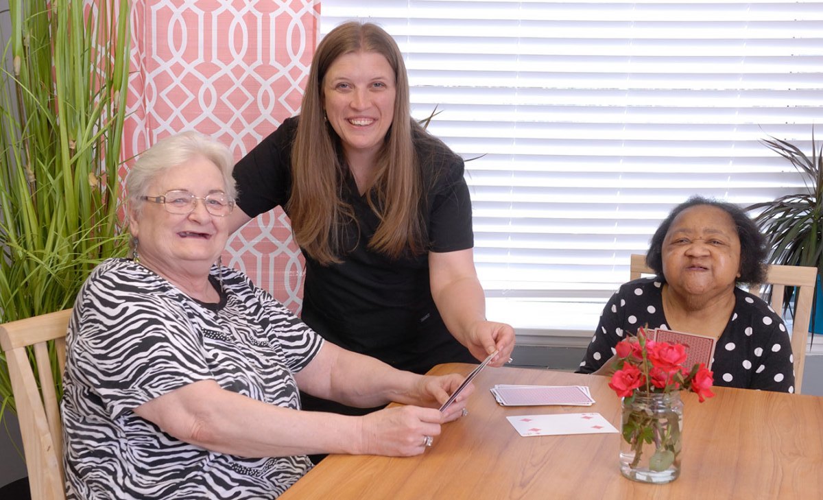 Residents engaged in an activity with staff.