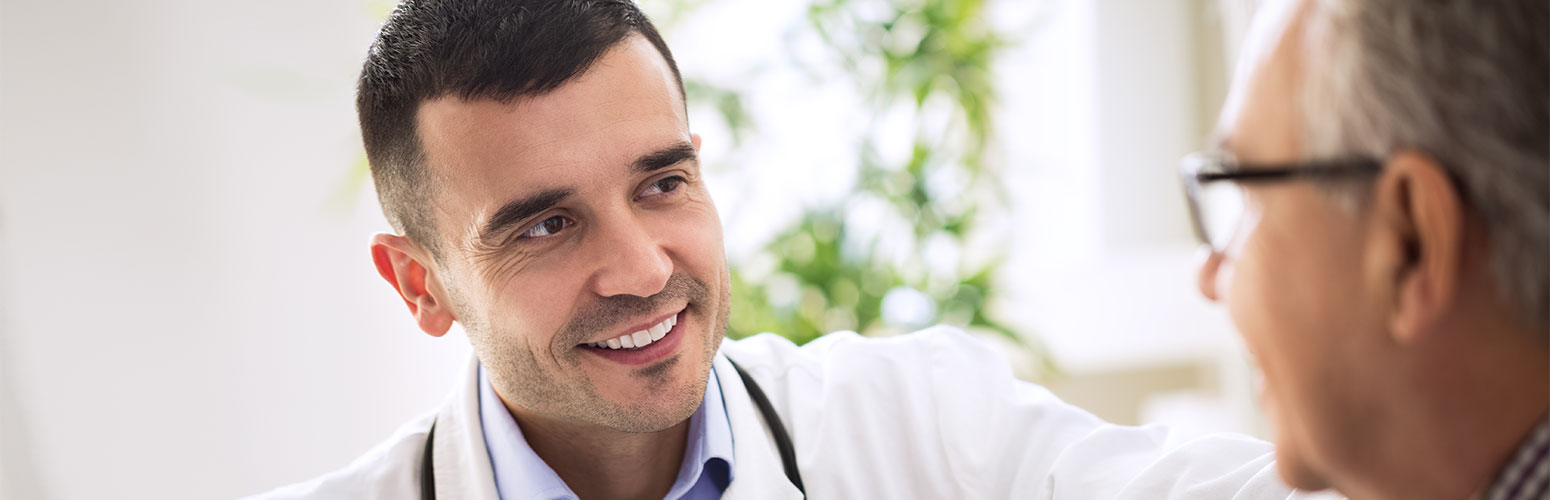 Healthcare professional interacting with a senior resident.