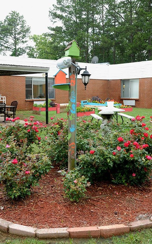 Garden area with decorative elements and flowers