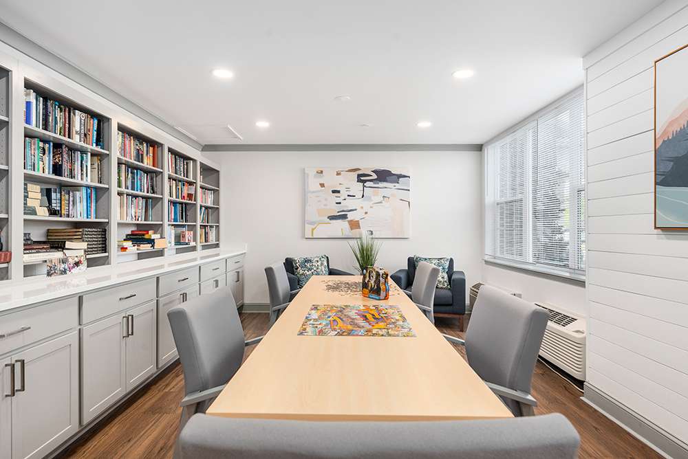 Bright activity room with bookshelves and seating