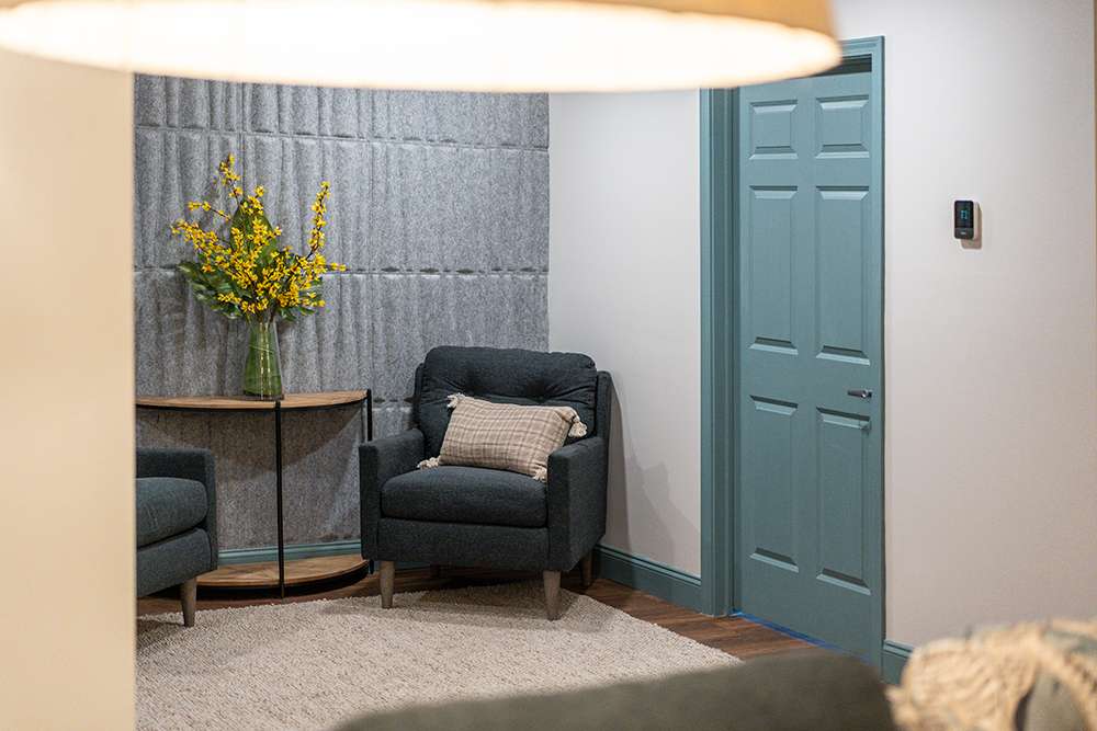 Comfortable seating area with flowers in a senior living facility