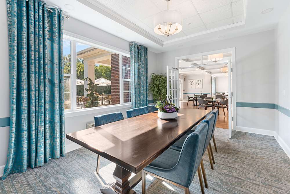 Bright and inviting common area with a dining table