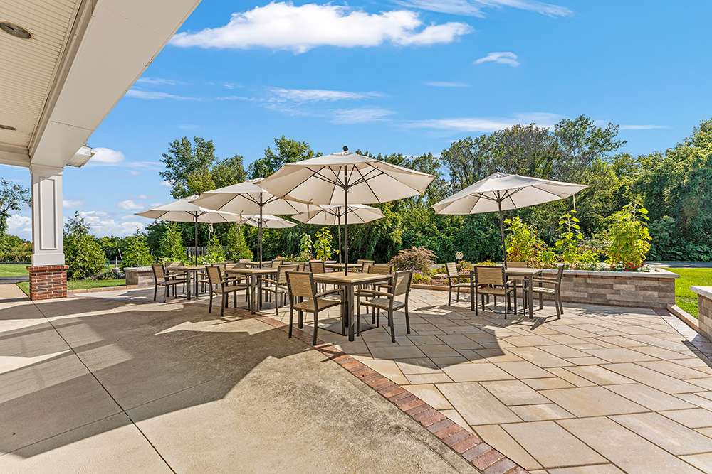 Outdoor seating area with umbrellas on a sunny day