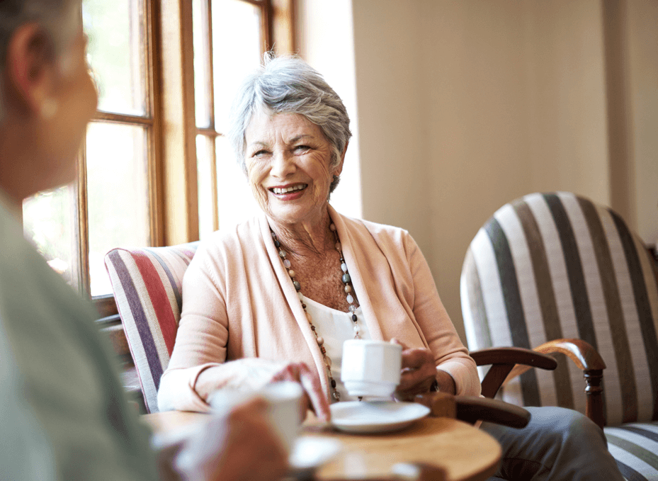 Senior woman enjoying a cup of coffee in a bright room