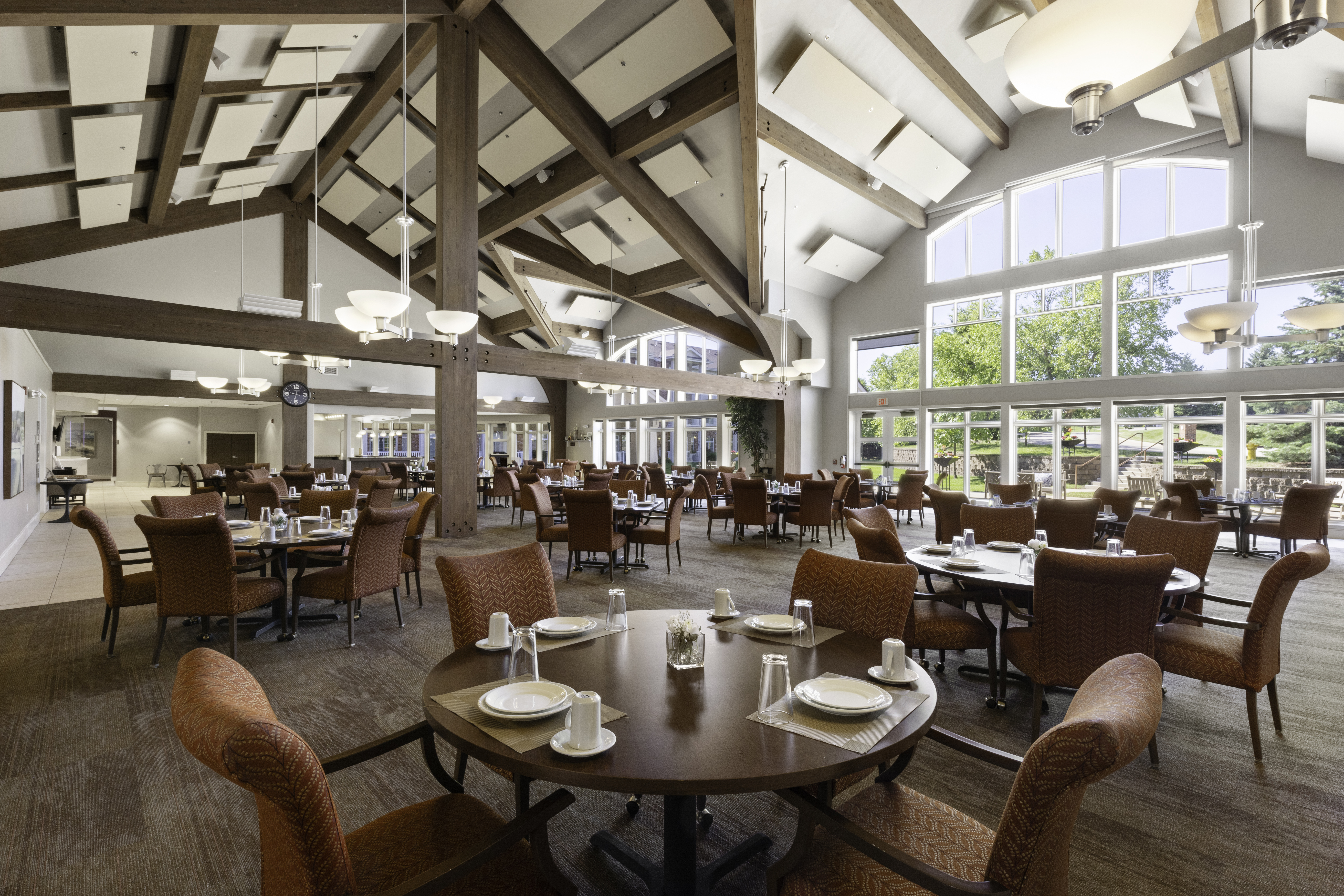 Dining room with tables set for residents