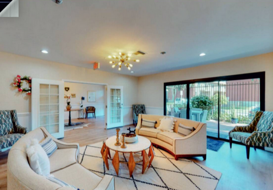 Bright common area with seating and natural light