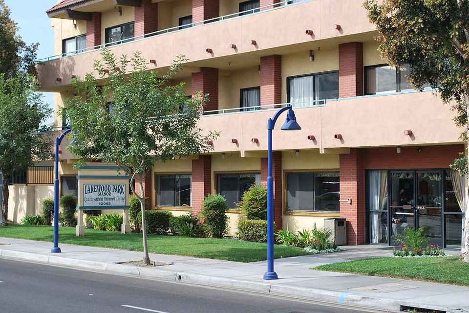 Exterior view of a senior living facility with landscaping