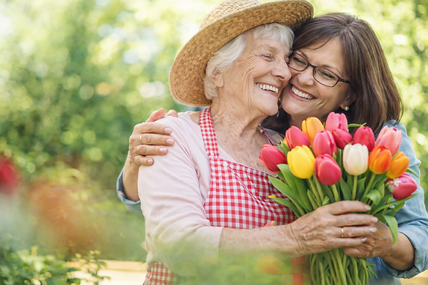 Residents enjoying time in the garden with tulips