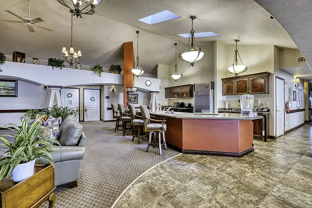Bright interior of a common area with seating and kitchen