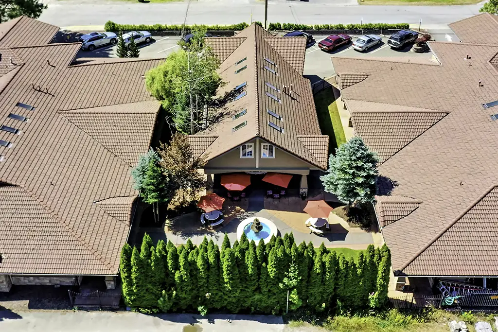 Aerial view of outdoor space with pool and seating