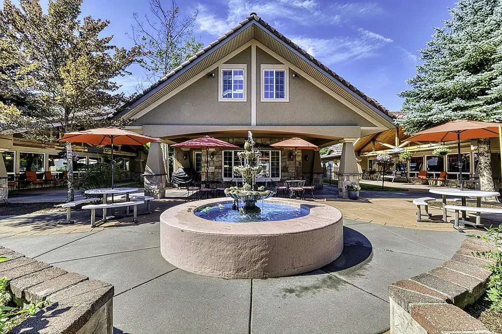 Outdoor courtyard with fountain and seating area