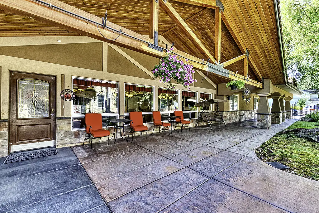 Exterior view of the facility entrance with seating area
