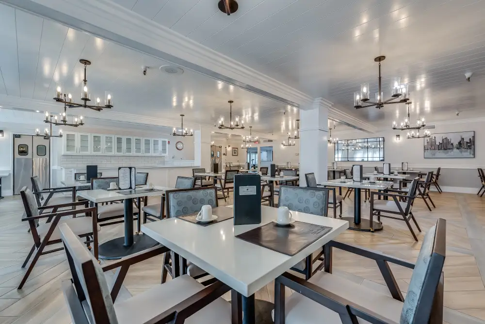 Bright dining area with elegant seating and chandeliers