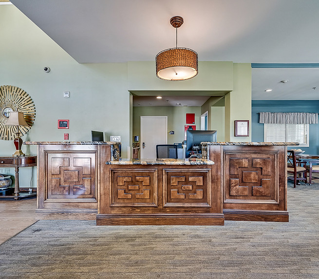 Reception area with wooden counter and decor