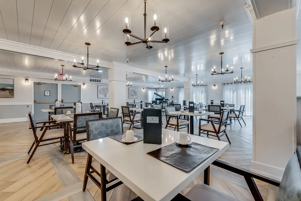 Dining area with tables set for residents