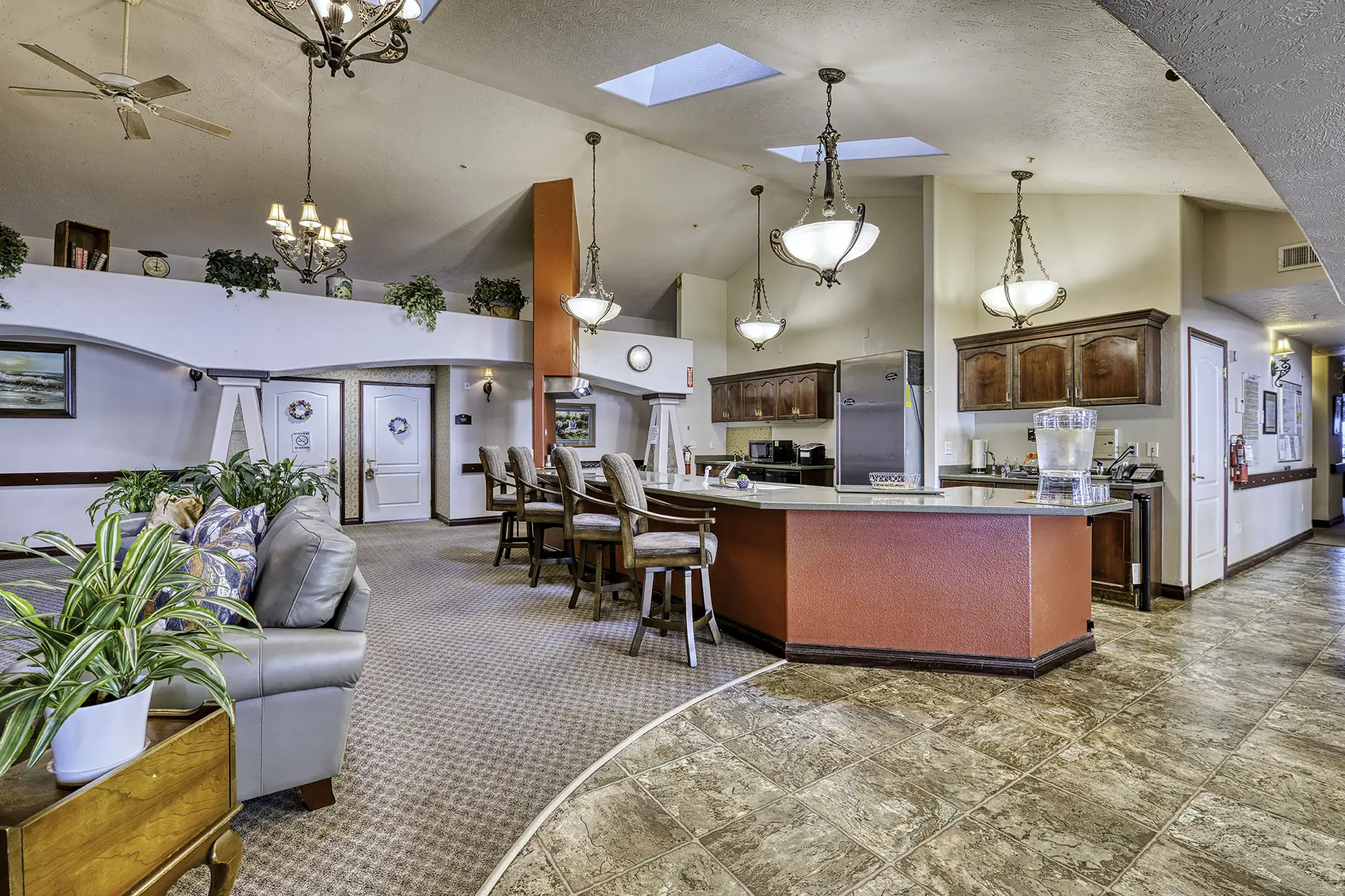 Bright common area with dining and seating arrangements