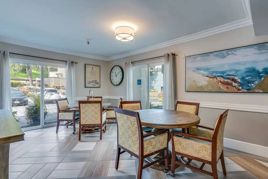 Bright common area with tables and chairs