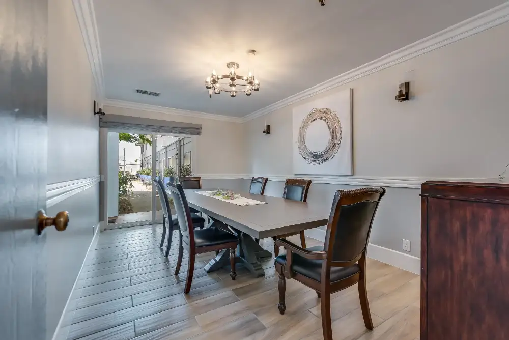 Bright dining area with a large table and chairs