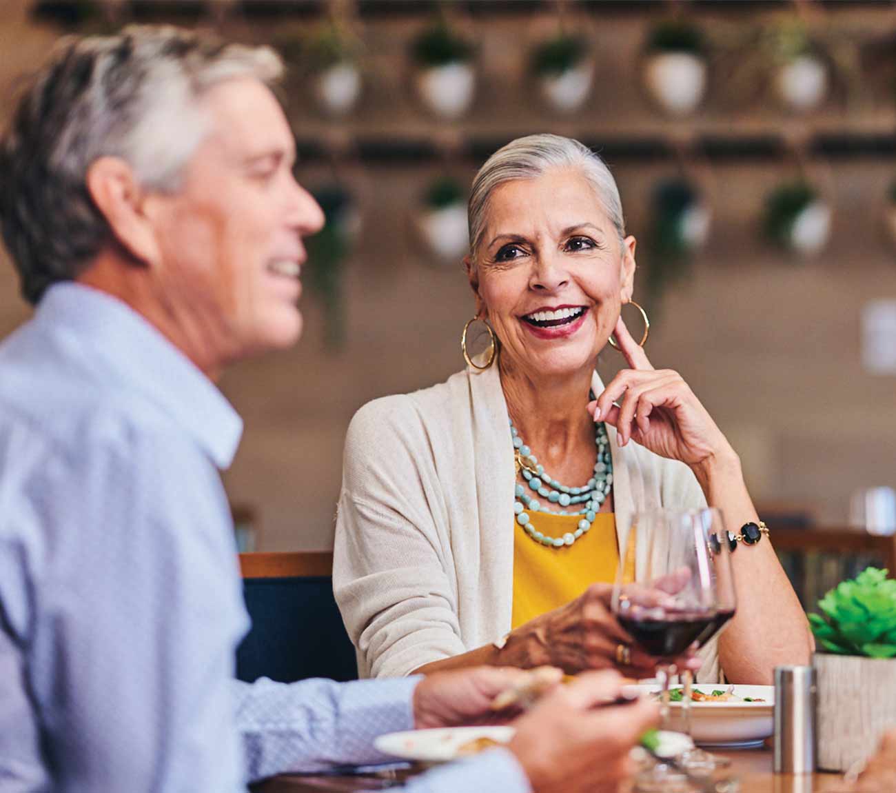 Two residents enjoying a meal together in a dining area