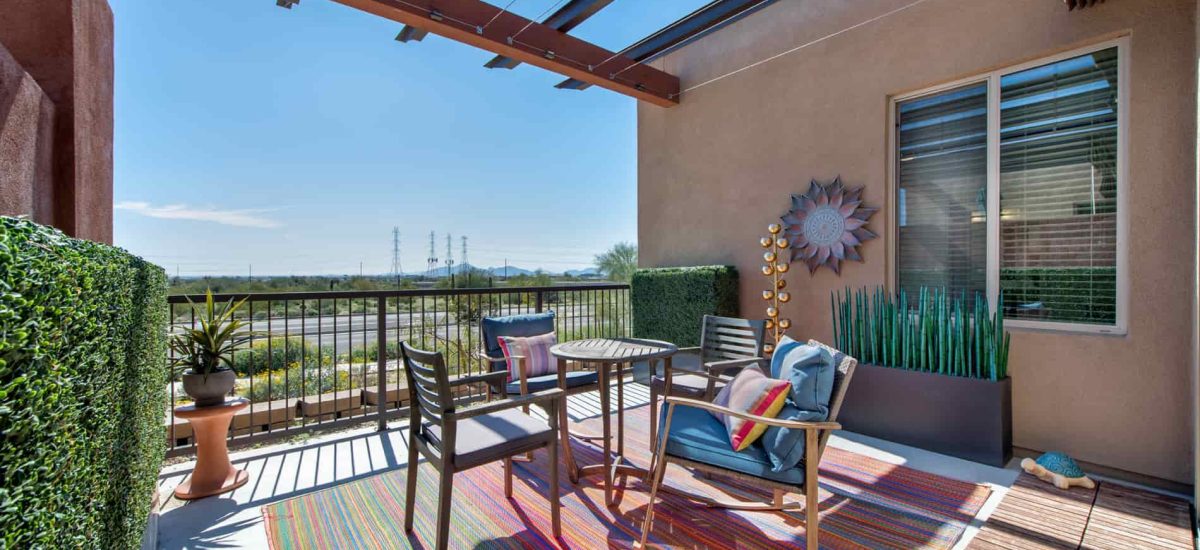 Outdoor patio area with seating and decorative elements