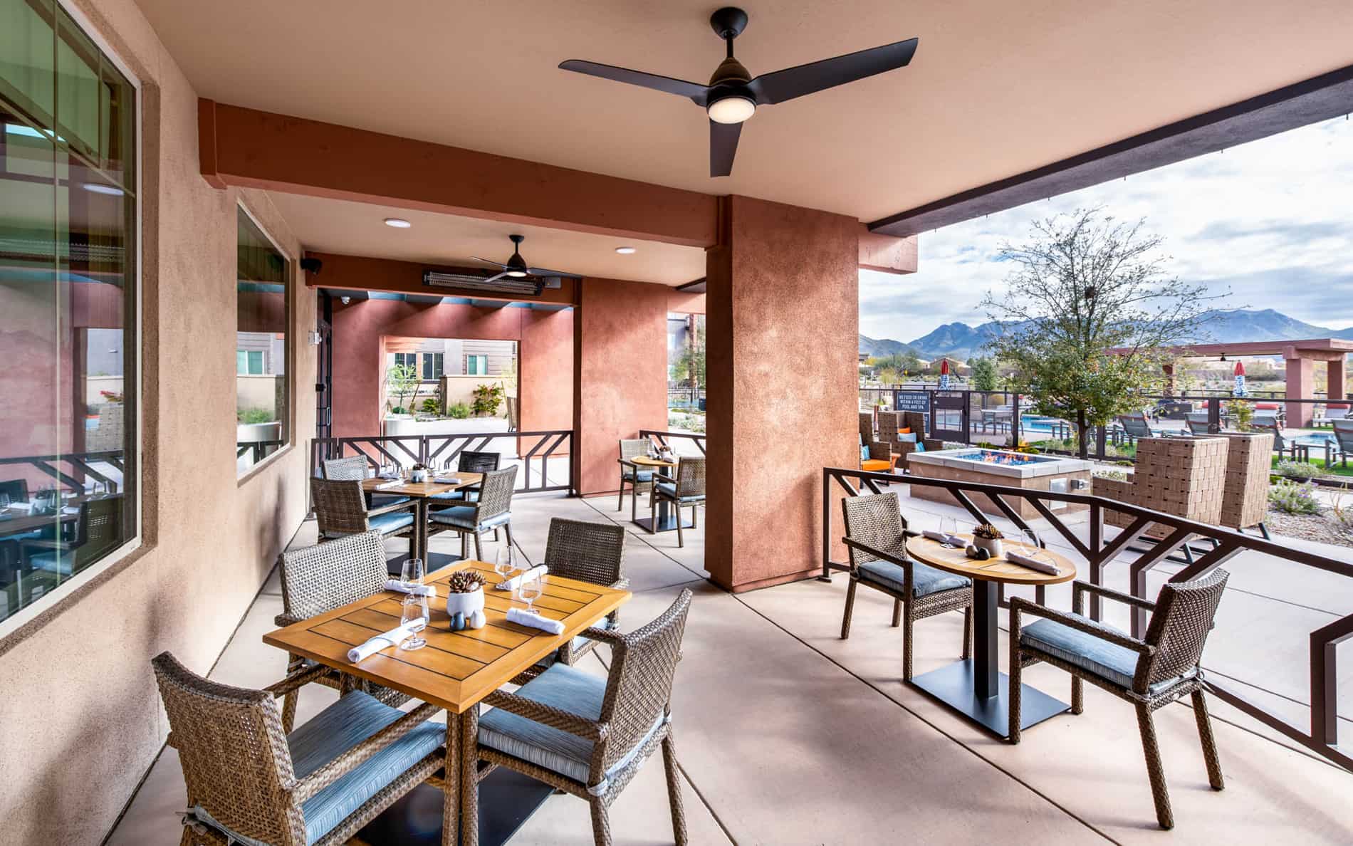 Outdoor dining area with tables and chairs