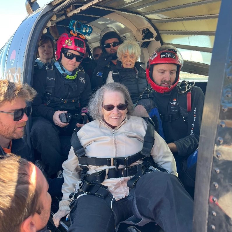 Residents and staff preparing for a skydiving experience