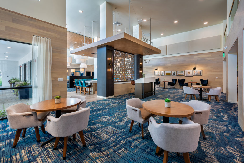 Bright common area with tables and chairs