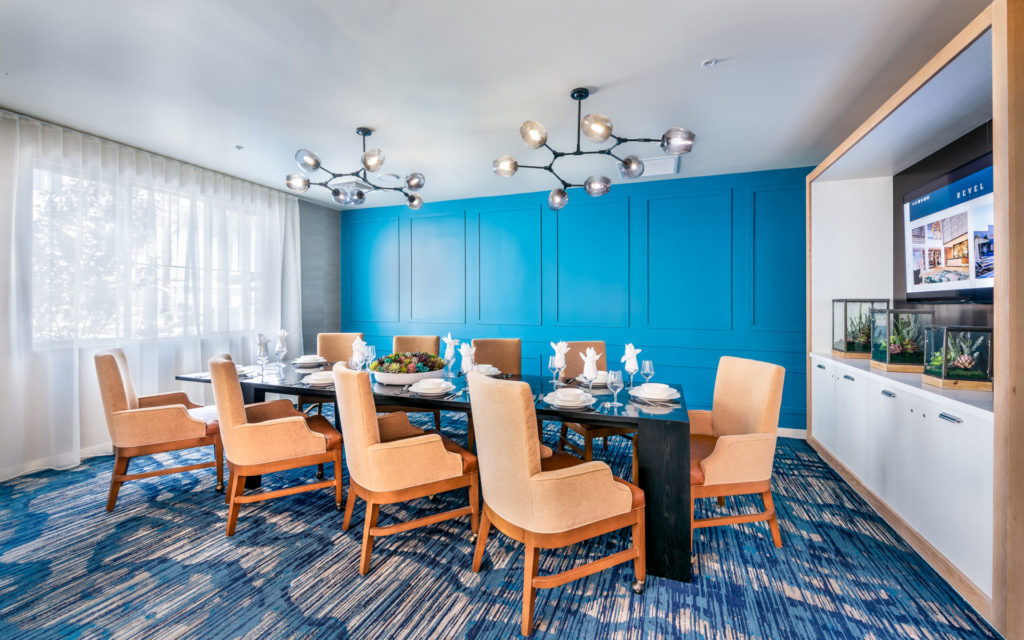 A dining room set up for a meal with elegant decor