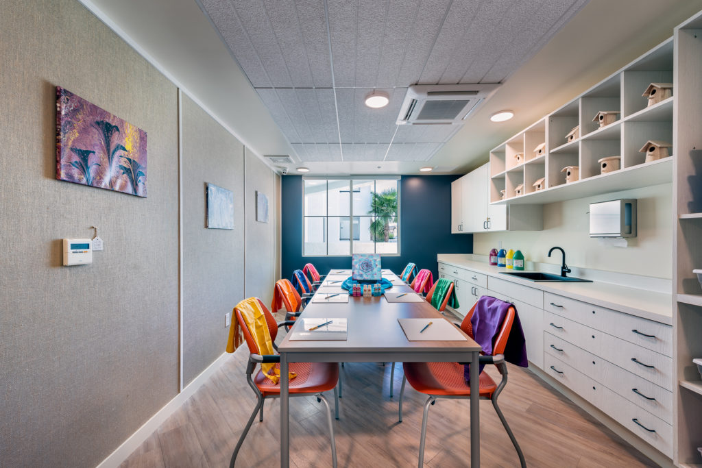 Bright and modern activity room with a large table