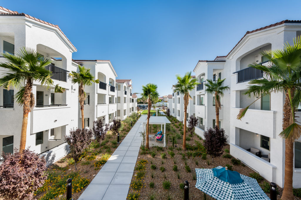 Courtyard view of residential buildings with landscaping
