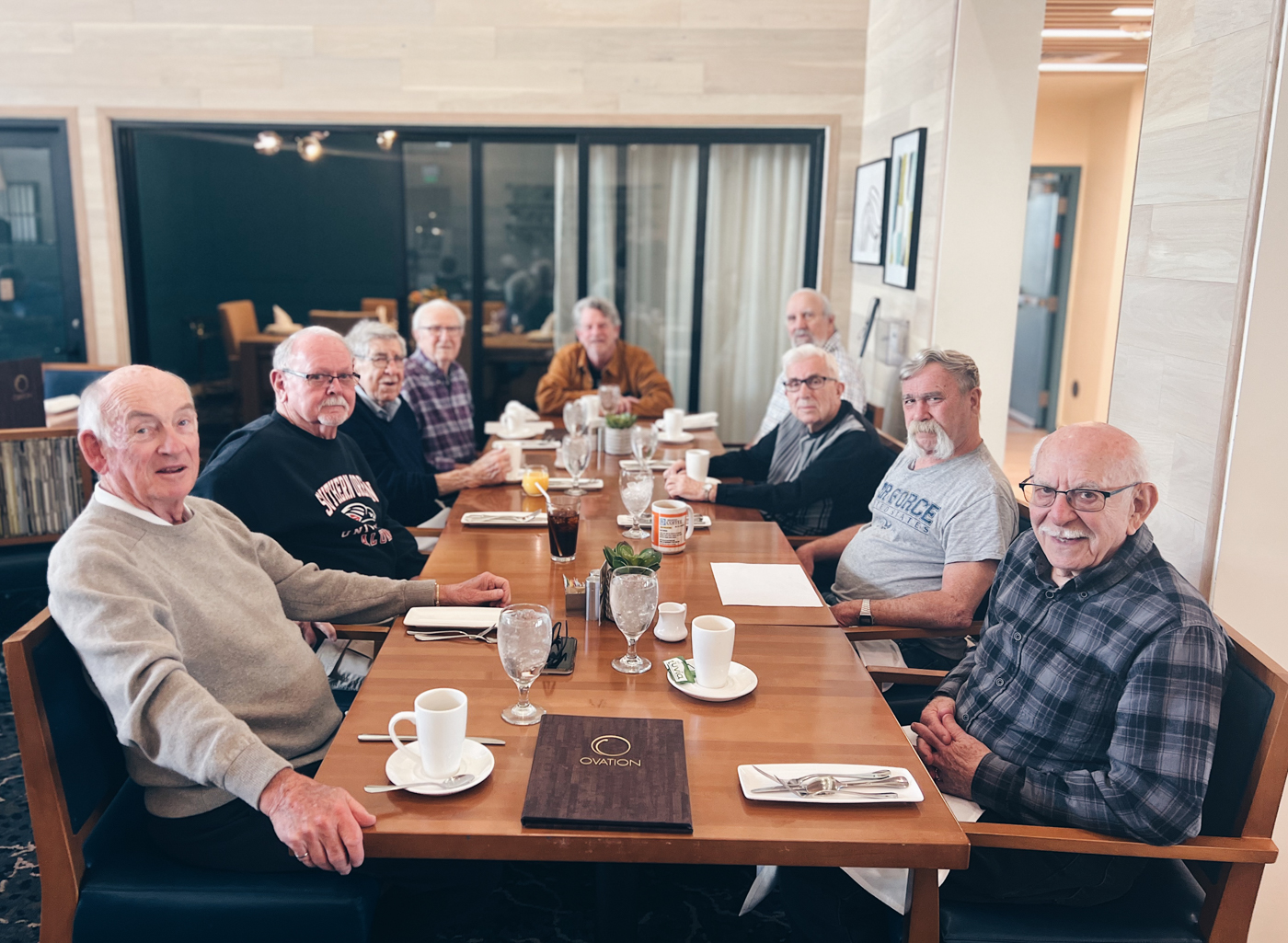 Residents enjoying a meal together in the dining room