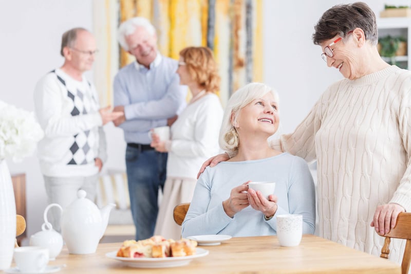 Residents enjoying coffee and pastries in a social setting