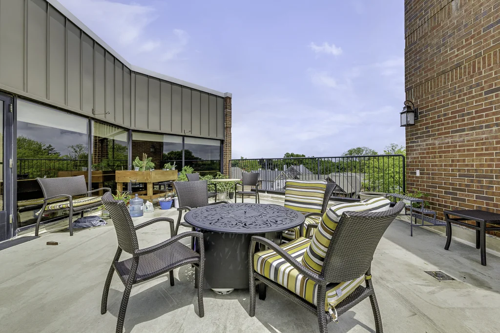Outdoor patio area with seating and plants