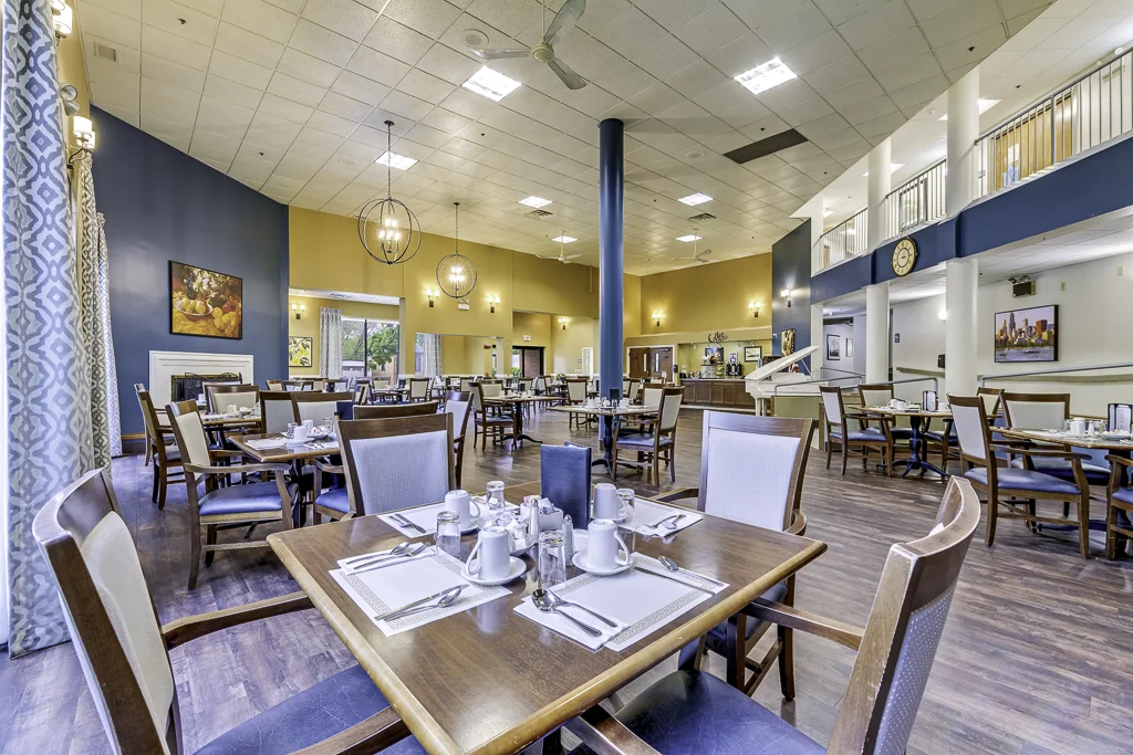 Bright dining room with tables set for meals