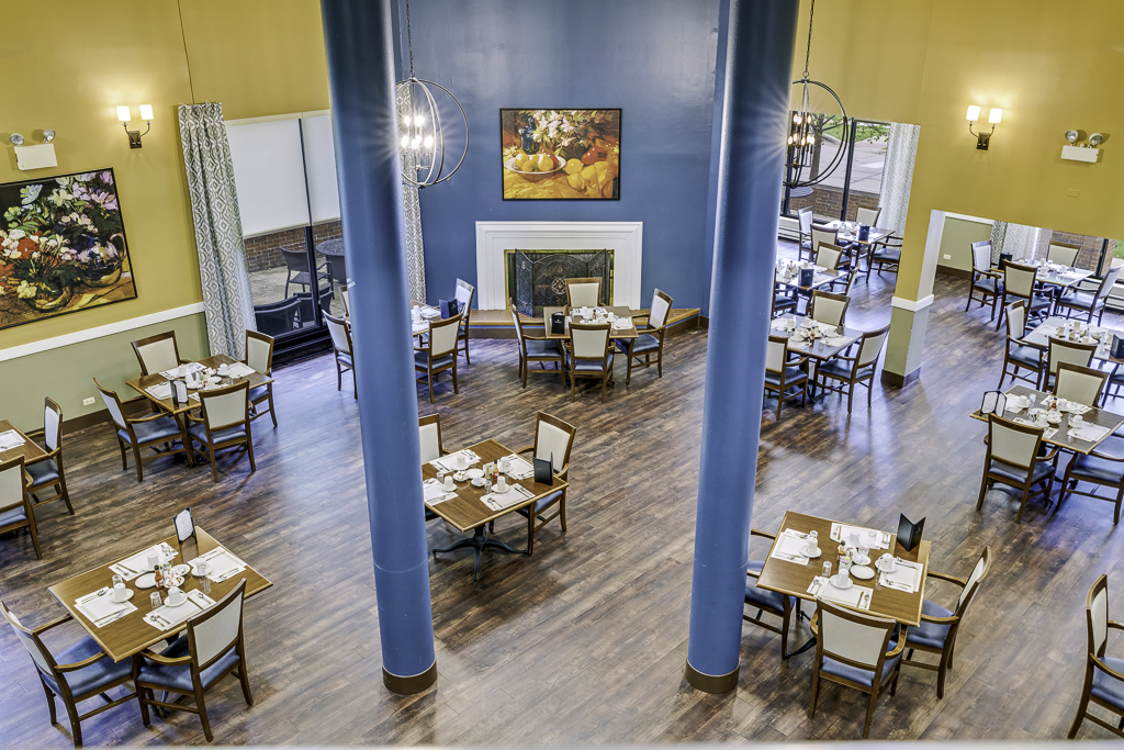 Dining room setup with tables and chairs