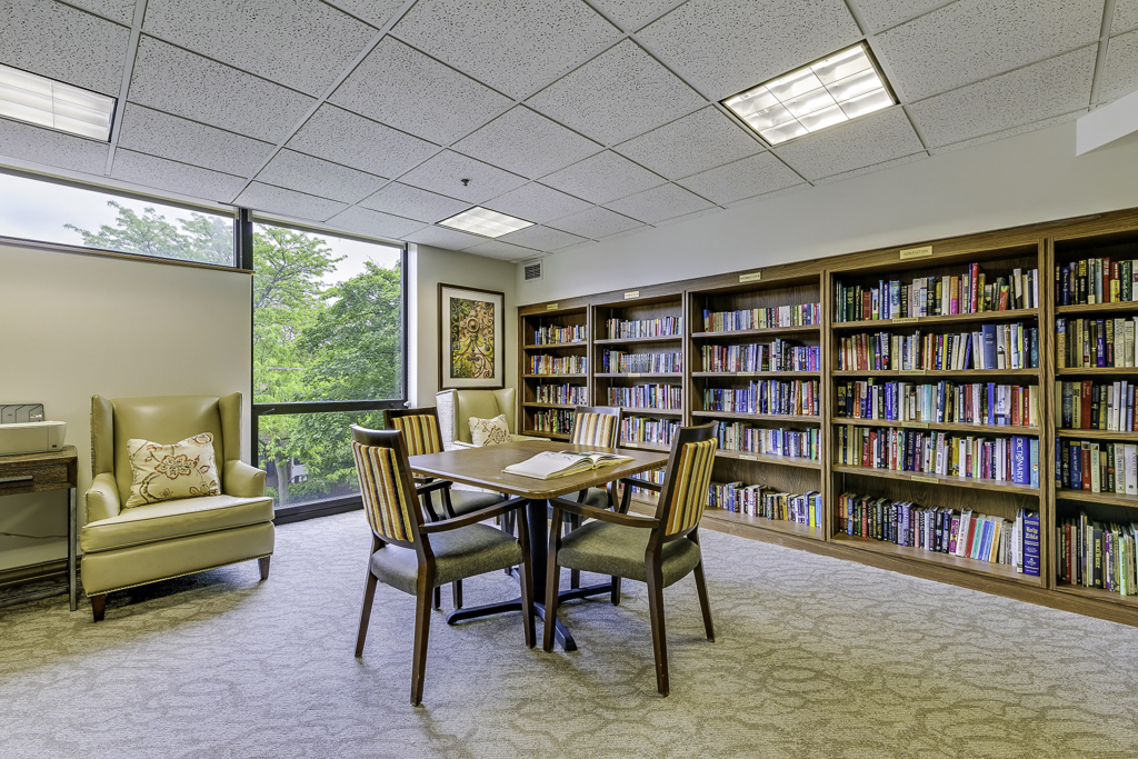 Bright activity room with bookshelves and seating