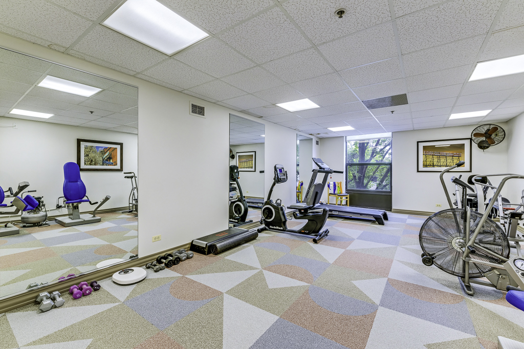 Well-equipped fitness room with exercise machines