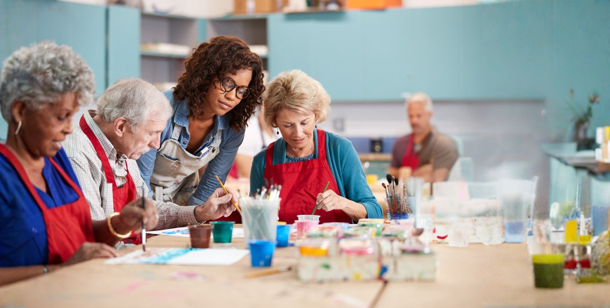 Residents participating in a painting activity