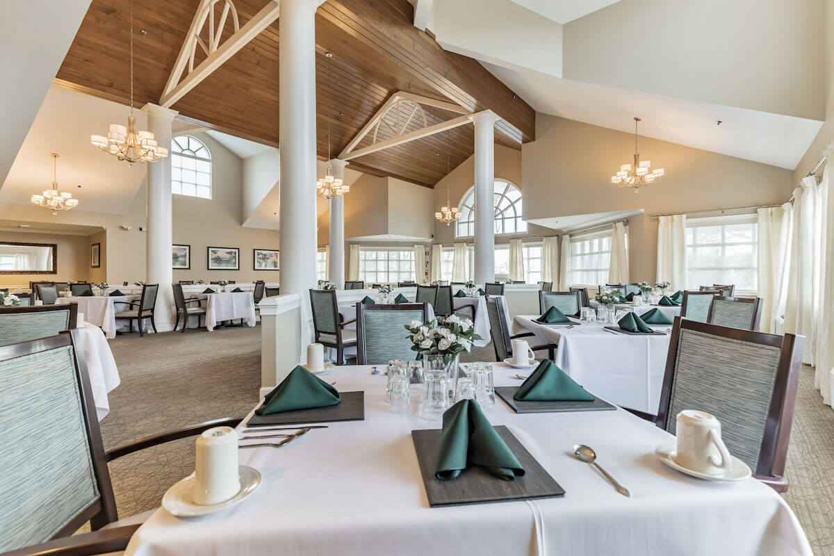 Elegant dining room setup with tables and chairs