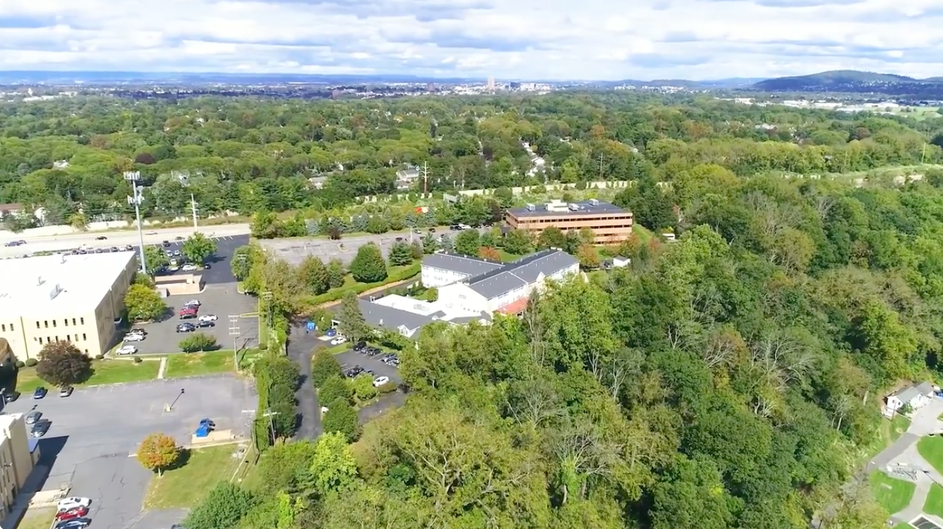 Aerial view of Rittenhouse Village surrounded by greenery