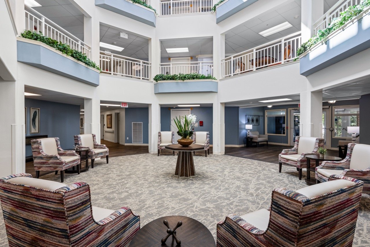 Bright lobby area with seating and greenery