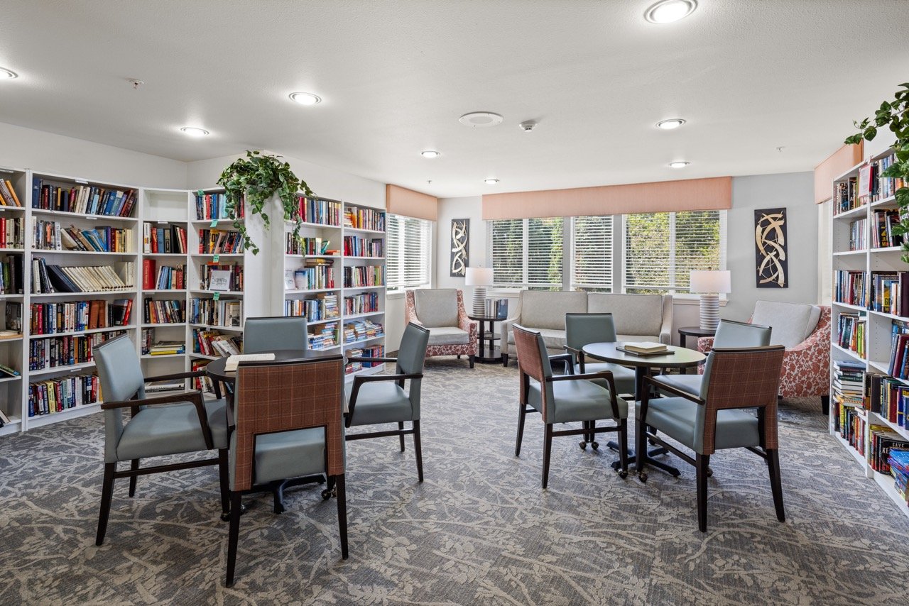 Cozy common area with bookshelves and seating
