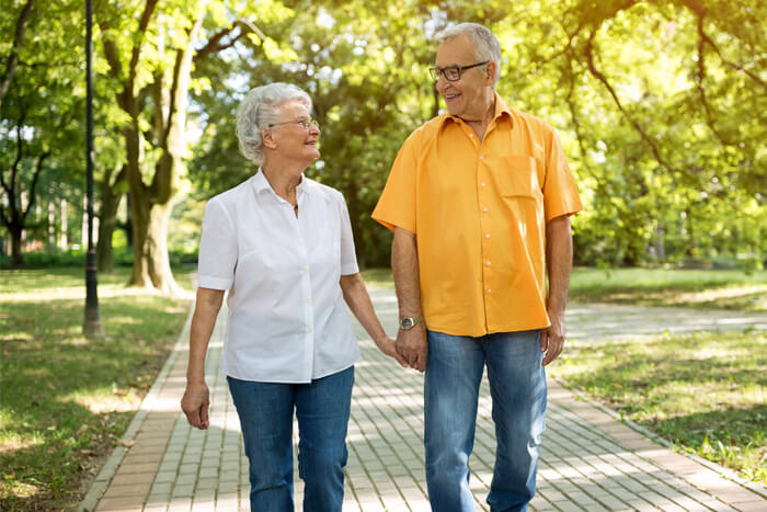 Senior couple walking together in a park