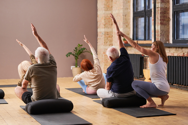 Residents participating in a yoga class
