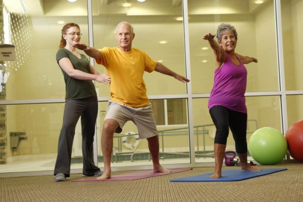 Residents participating in a group yoga class