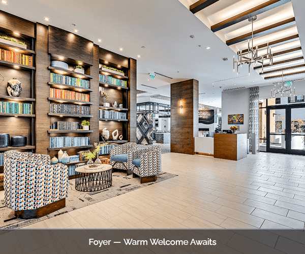 Bright foyer area with seating and bookshelves