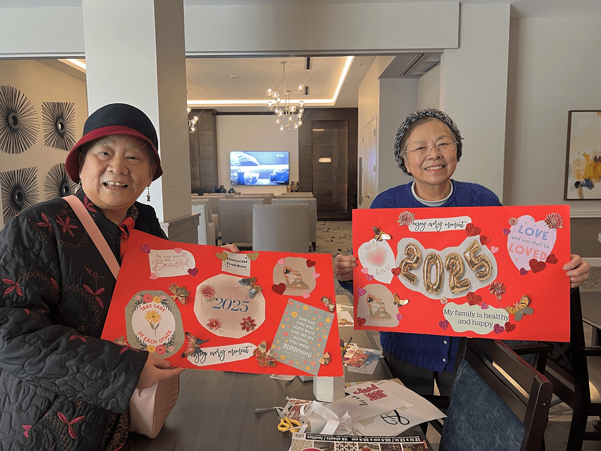 Residents sharing their decorated posters in a common area
