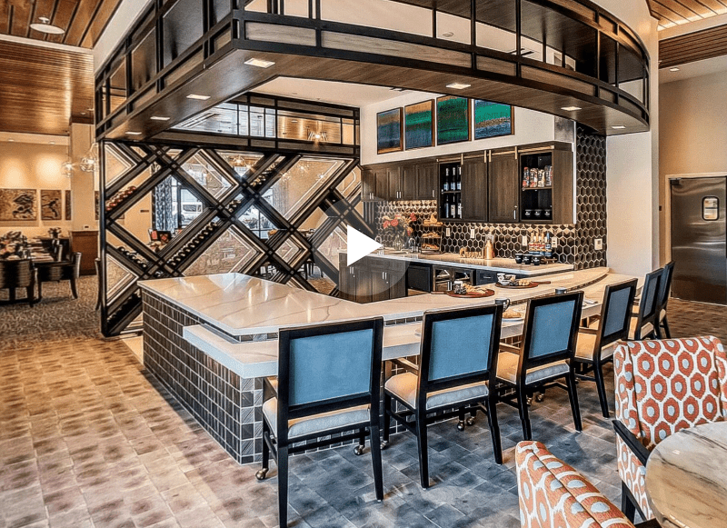 Bright and modern interior dining area with bar seating